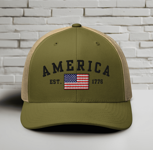 America Est. 1776 Trucker Hat – Black Embroidery, Patriotic Cap for Proud Americans, Perfect Gift for Freedom Lovers