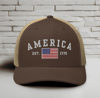America Est. 1776 Trucker Hat – White Embroidery, Patriotic Cap for Proud Americans, Perfect Gift for Freedom Lovers
