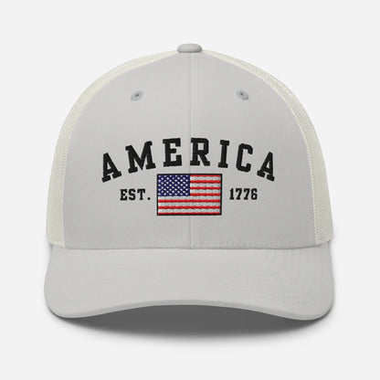 America Est. 1776 Trucker Hat – Black Embroidery, Patriotic Cap for Proud Americans, Perfect Gift for Freedom Lovers - SKULLFURY MERCH