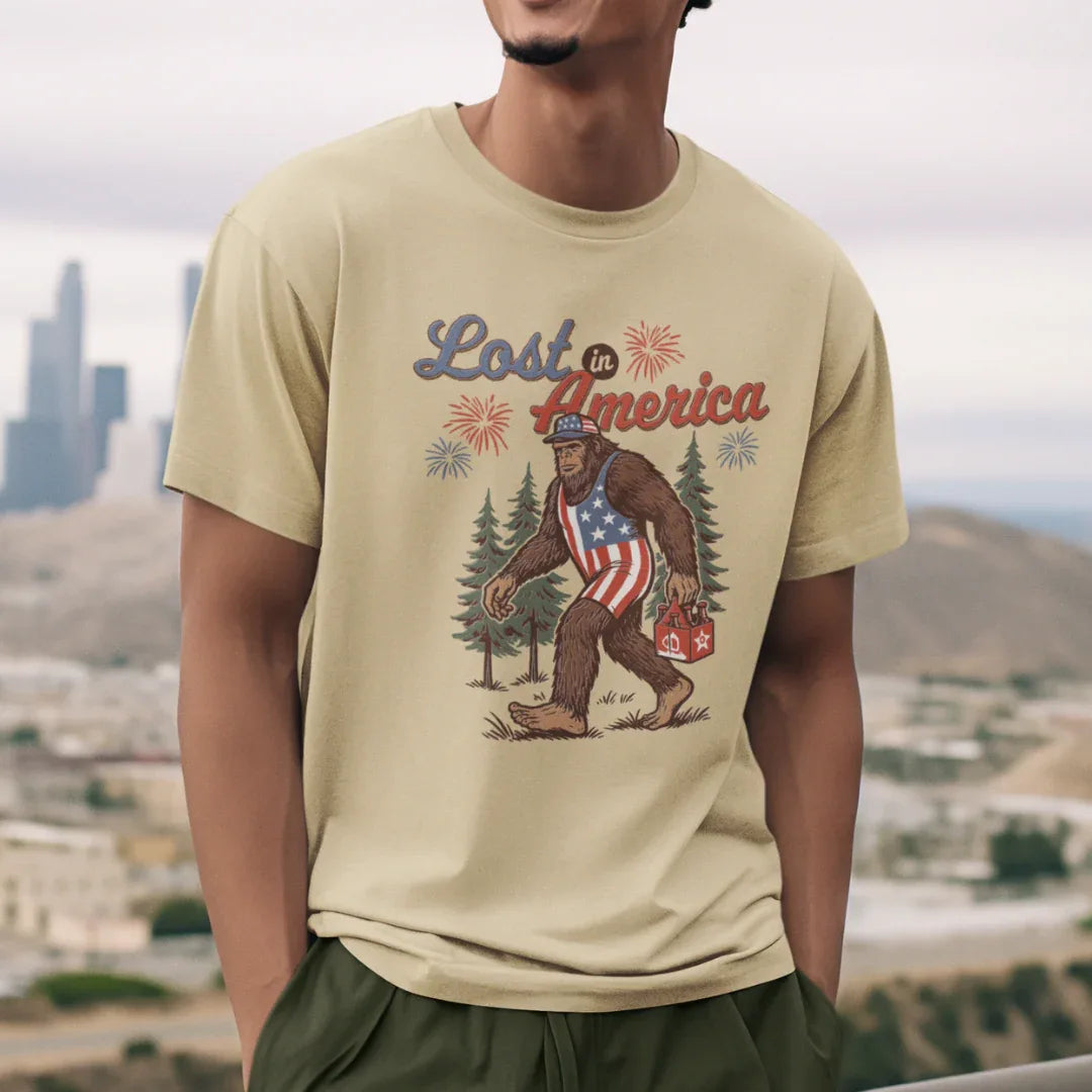 Lost in America Bigfoot Tee, Casual Summer Shirt, Outdoor Adventure Tee, Fun Gift for Nature Lovers, Festival Outfit, Patriotic Apparel - SKULLFURY MERCH