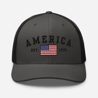 America Est. 1776 Trucker Hat – Black Embroidery, Patriotic Cap for Proud Americans, Perfect Gift for Freedom Lovers